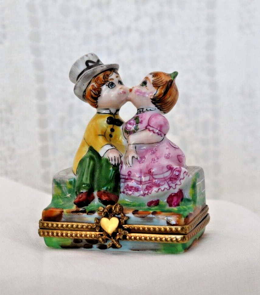 Limoges, France Porcelain Kissing Couple Sitting on a Wall Shaped Trinket Box - LADYBIRD LAUGH