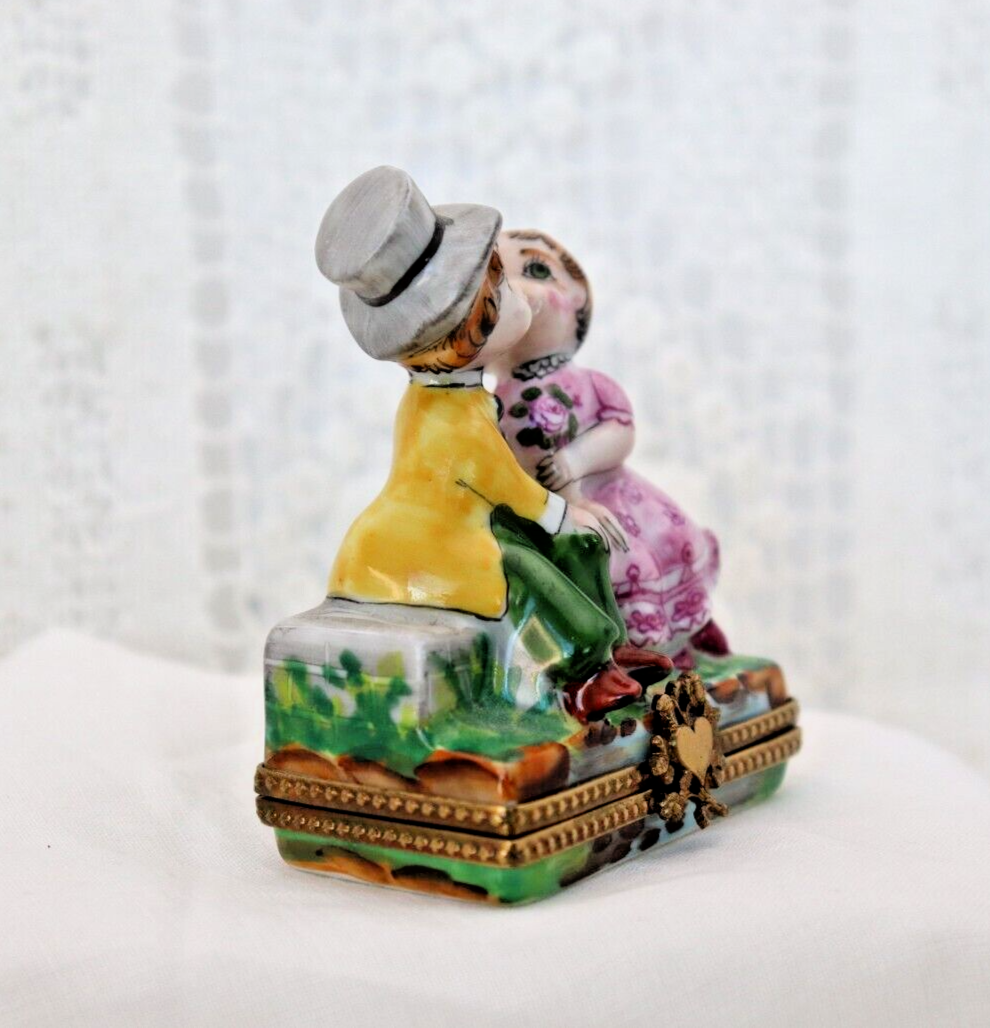 Limoges, France Porcelain Kissing Couple Sitting on a Wall Shaped Trinket Box - LADYBIRD LAUGH