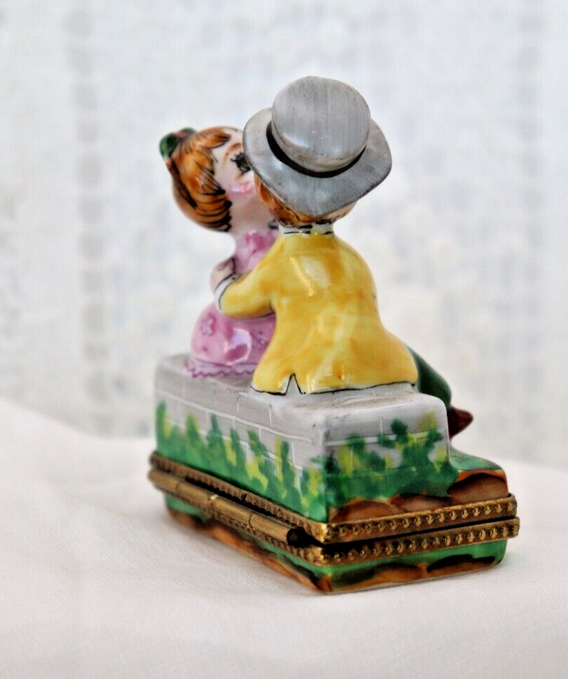 Limoges, France Porcelain Kissing Couple Sitting on a Wall Shaped Trinket Box - LADYBIRD LAUGH