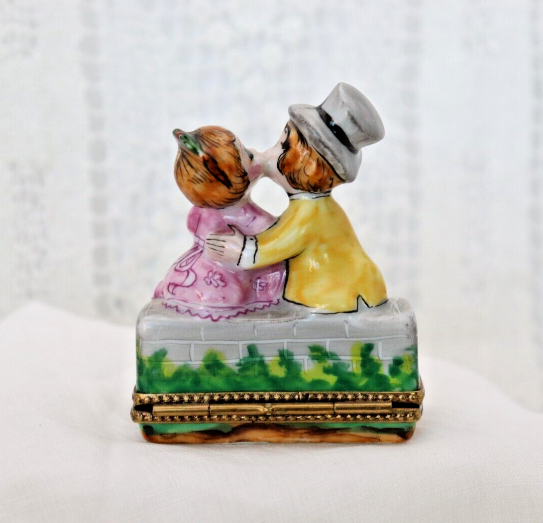 Limoges, France Porcelain Kissing Couple Sitting on a Wall Shaped Trinket Box - LADYBIRD LAUGH