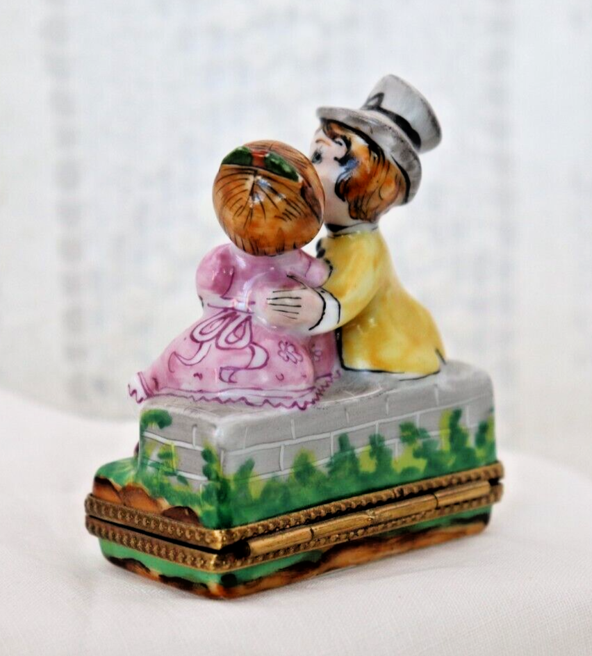 Limoges, France Porcelain Kissing Couple Sitting on a Wall Shaped Trinket Box - LADYBIRD LAUGH