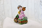 Limoges, France Porcelain Kissing Couple Sitting on a Wall Shaped Trinket Box - LADYBIRD LAUGH