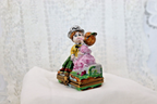 Limoges, France Porcelain Kissing Couple Sitting on a Wall Shaped Trinket Box - LADYBIRD LAUGH