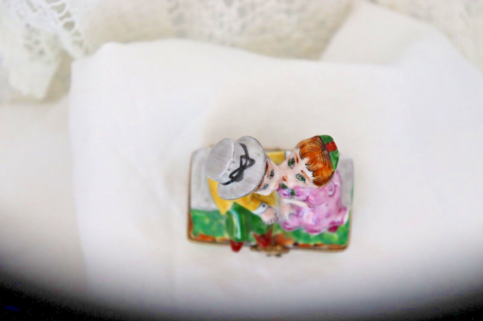 Limoges, France Porcelain Kissing Couple Sitting on a Wall Shaped Trinket Box - LADYBIRD LAUGH