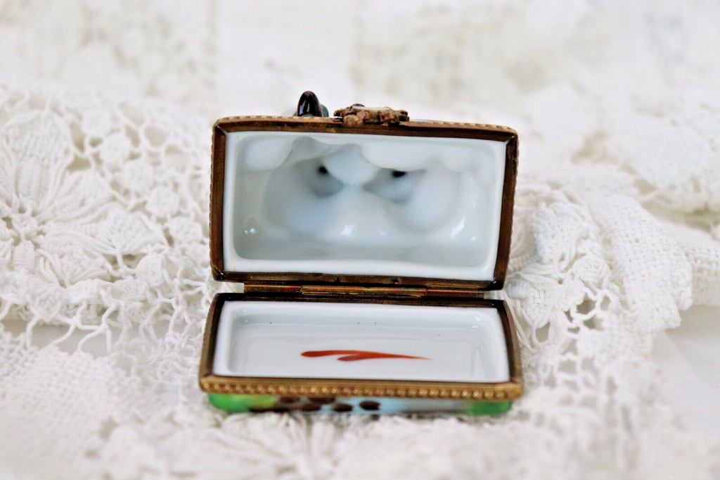 Limoges, France Porcelain Kissing Couple Sitting on a Wall Shaped Trinket Box - LADYBIRD LAUGH