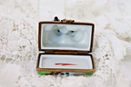 Limoges, France Porcelain Kissing Couple Sitting on a Wall Shaped Trinket Box - LADYBIRD LAUGH