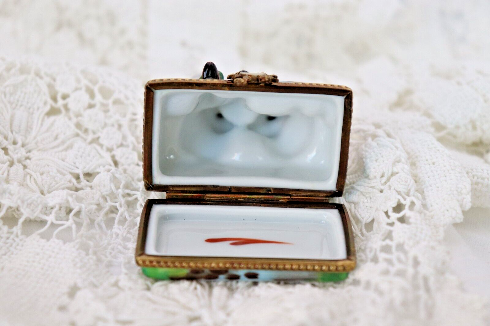 Limoges, France Porcelain Kissing Couple Sitting on a Wall Shaped Trinket Box - LADYBIRD LAUGH