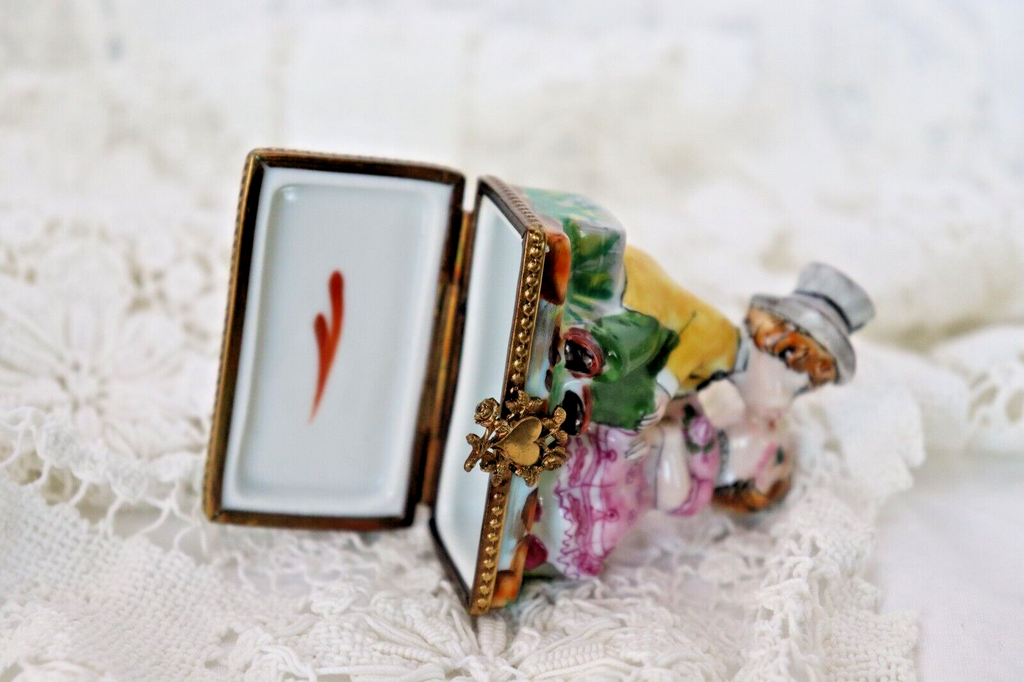 Limoges, France Porcelain Kissing Couple Sitting on a Wall Shaped Trinket Box - LADYBIRD LAUGH