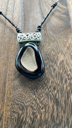 Beautiful Stone necklace with a silver ornament