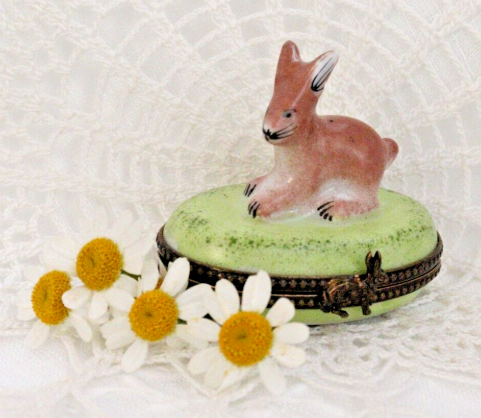 Decorative box with a rabbit design on a textured white background