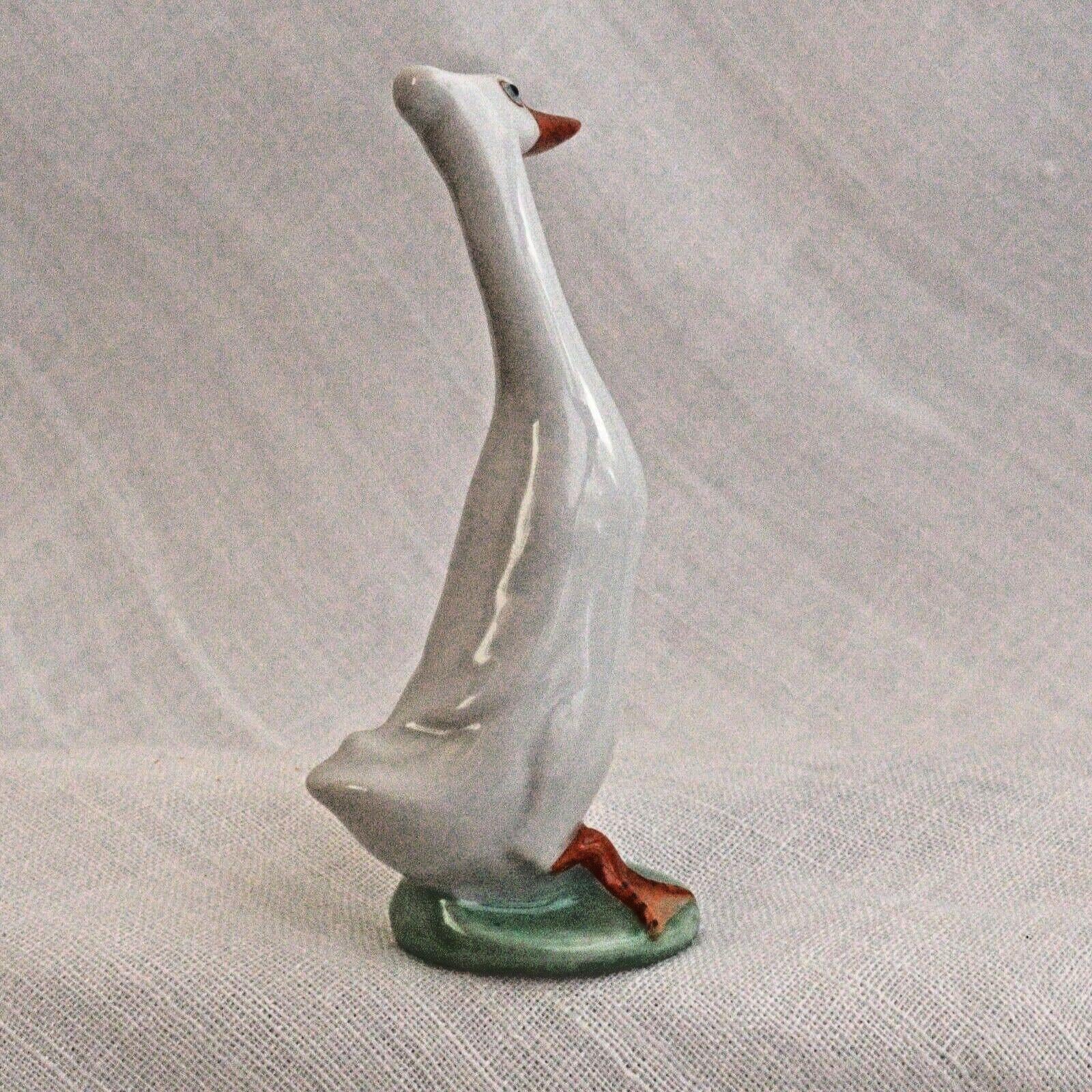 Porcelain Duck Figurine: Cheeky White Runner - Hand-Painted Art Nouveau