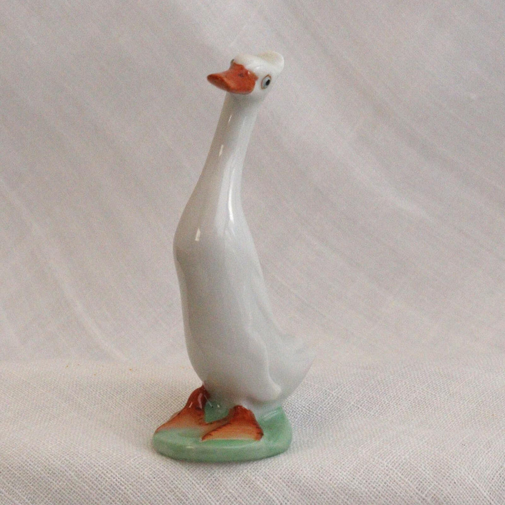 Porcelain Duck Figurine: Cheeky White Runner - Hand-Painted Art Nouveau