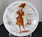 Decorative plate with a woman in a brown dress and hat, set against a white background.