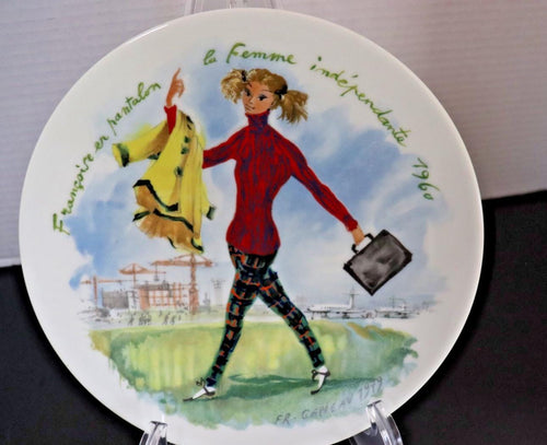 Decorative plate with a stylized illustration of a woman holding a coat and briefcase, set against a scenic background.