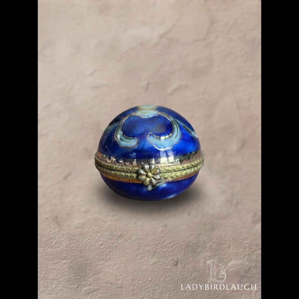 Vintage cobalt blue porcelain trinket box with crowned K mark, floral hinged pill box