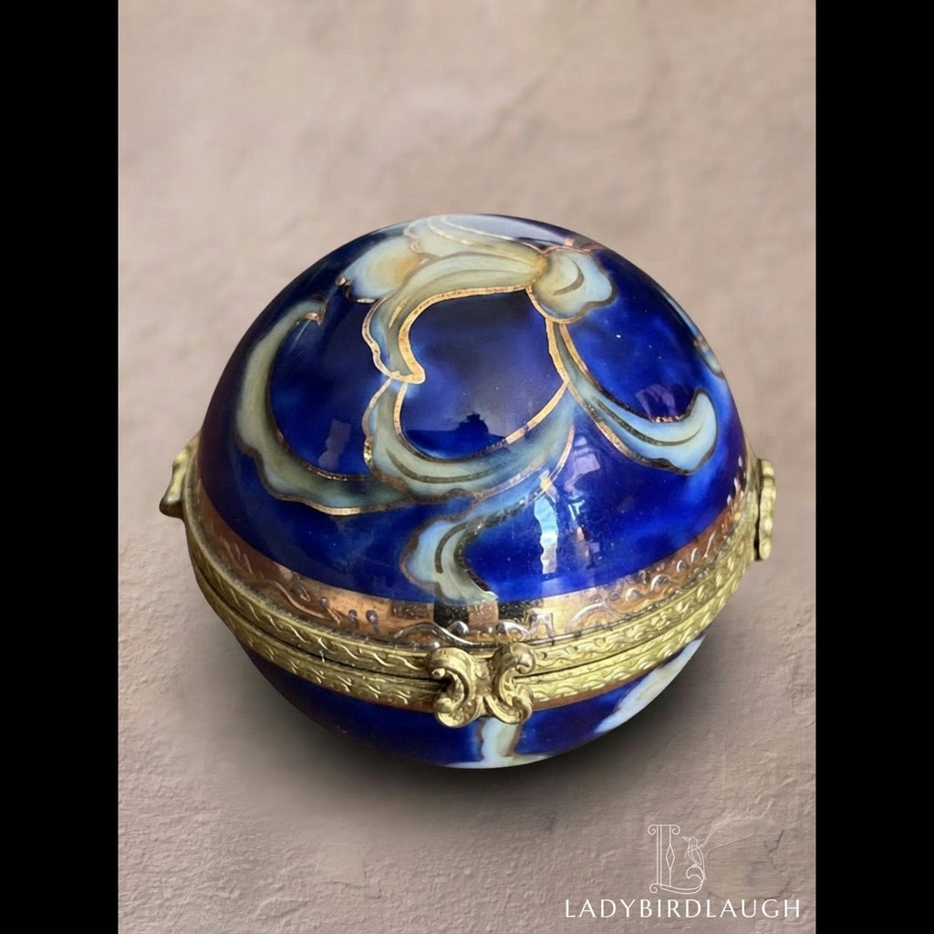 Vintage cobalt blue porcelain trinket box with crowned K mark, floral hinged pill box