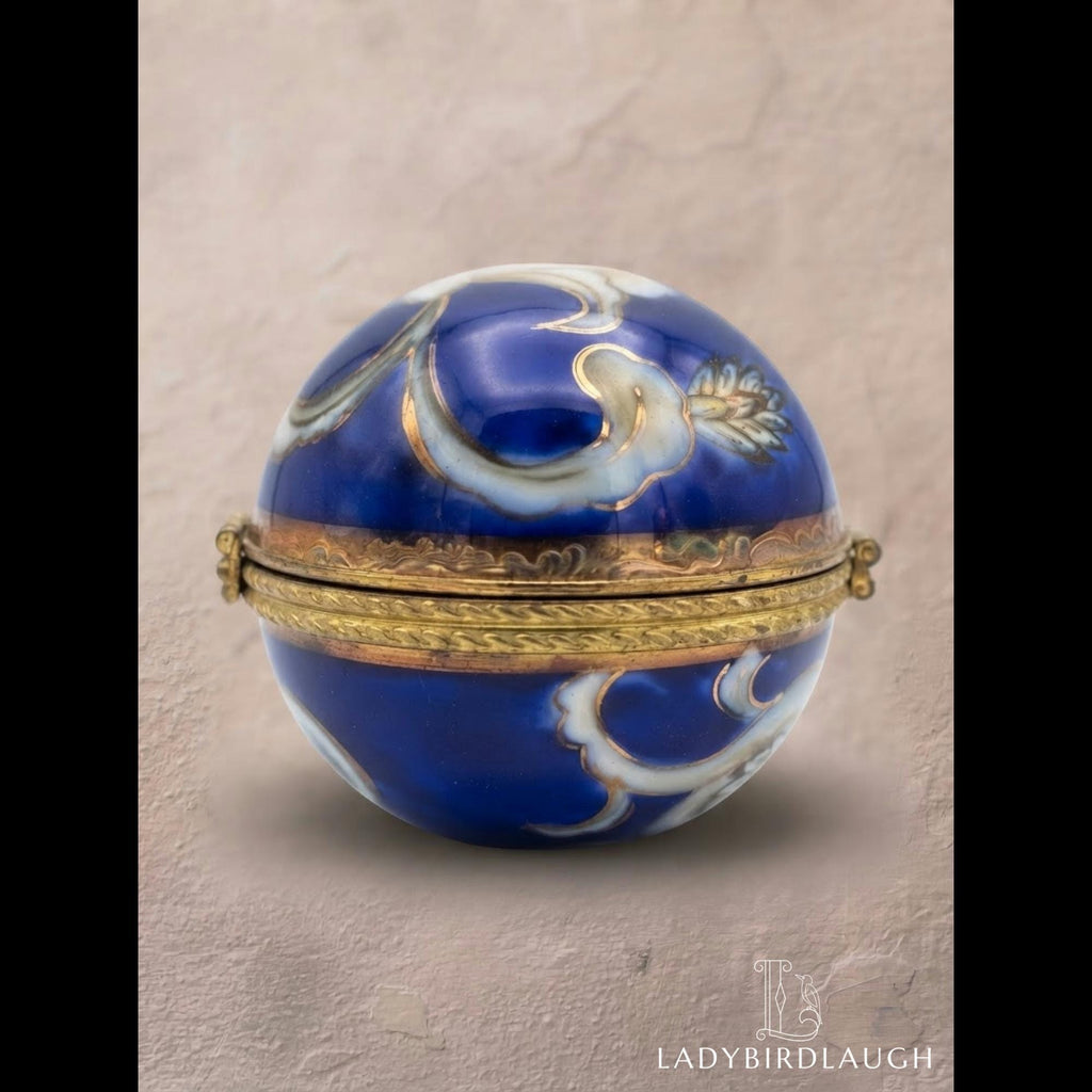 Vintage cobalt blue porcelain trinket box with crowned K mark, floral hinged pill box