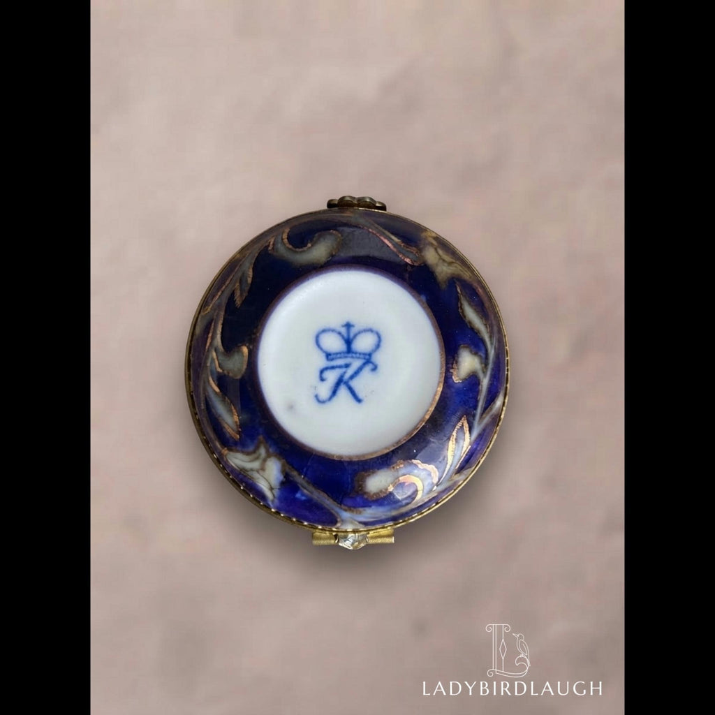 Vintage cobalt blue porcelain trinket box with crowned K mark, floral hinged pill box