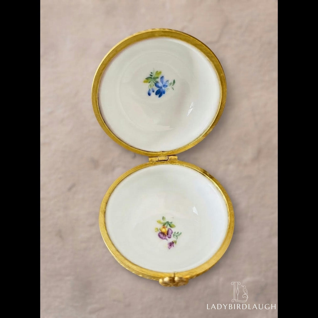 Vintage cobalt blue porcelain trinket box with crowned K mark, floral hinged pill box
