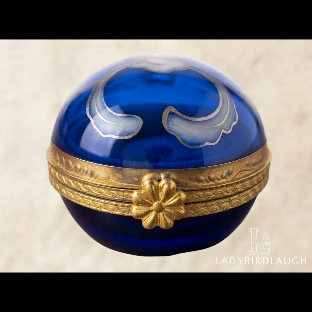 Vintage cobalt blue porcelain trinket box with crowned K mark, floral hinged pill box