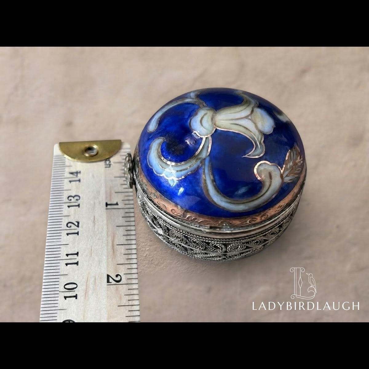 Vintage cobalt blue porcelain trinket box with crowned K mark, floral hinged pill box