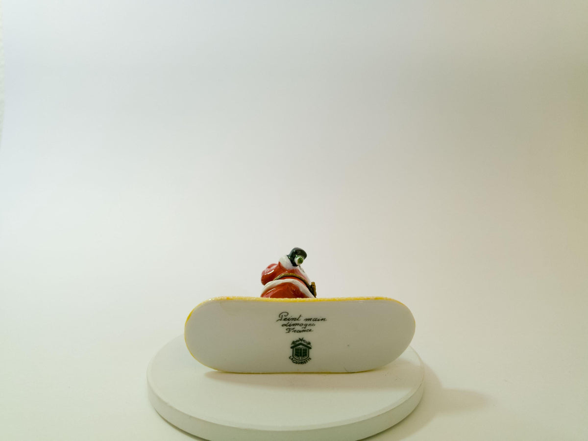 La Gloriette Limoges snowboarding Santa, hand painted French porcelain Christmas collectible