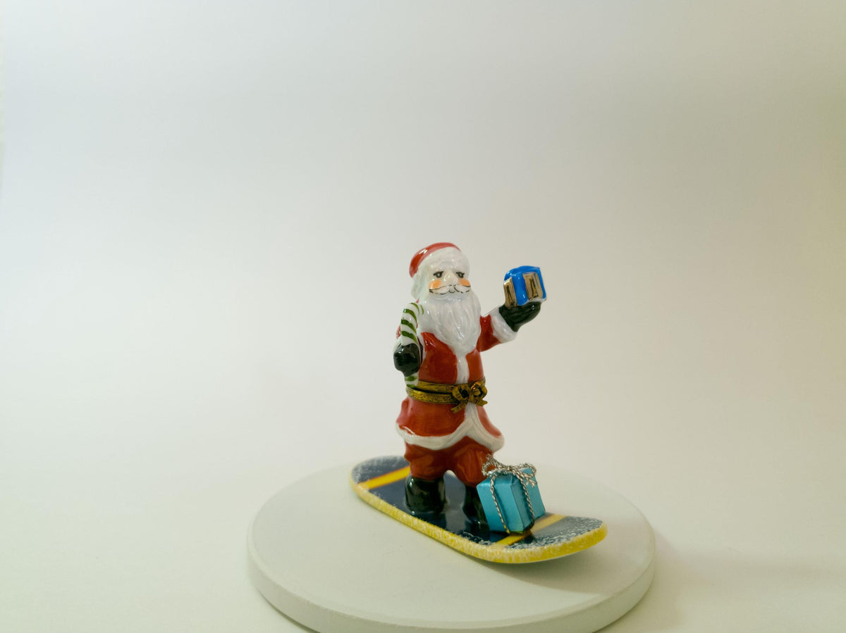 La Gloriette Limoges snowboarding Santa, hand painted French porcelain Christmas collectible