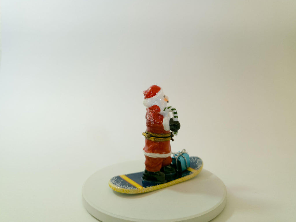 La Gloriette Limoges snowboarding Santa, hand painted French porcelain Christmas collectible