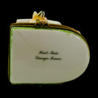 Limoges France doghouse trinket box with dog and snowy Christmas tree, hand-painted porcelain