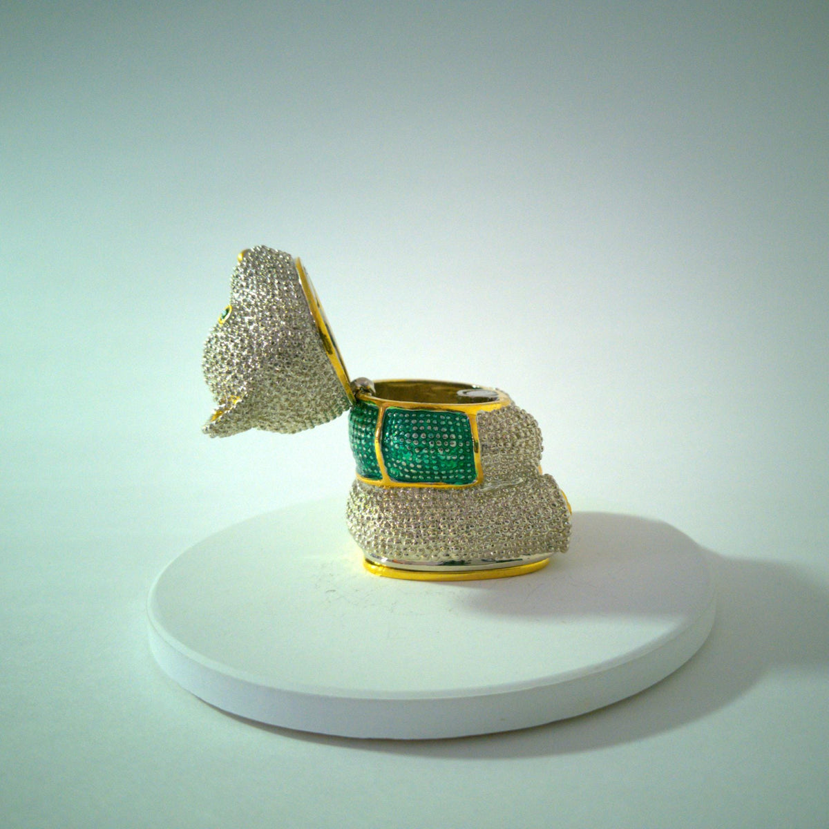 Rhinestone teddy bear trinket box, green jeweled eyes, gold-tone accents