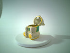 Rhinestone teddy bear trinket box, green jeweled eyes, gold-tone accents