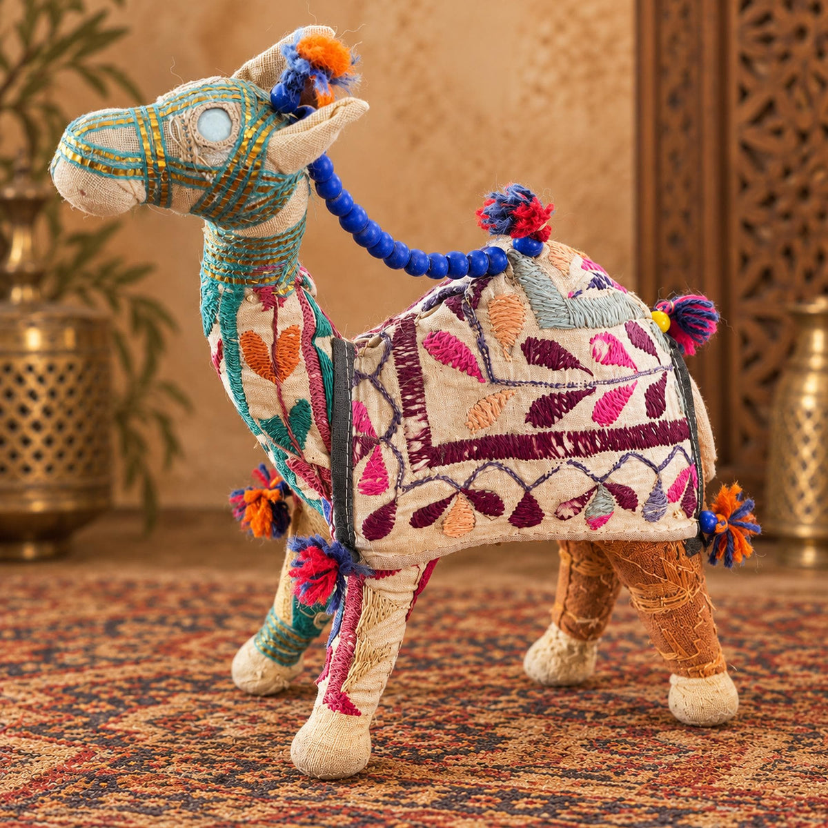 Embroidered Indian fabric camel figurine with blue beads, colorful tassels and bohemian folk art details