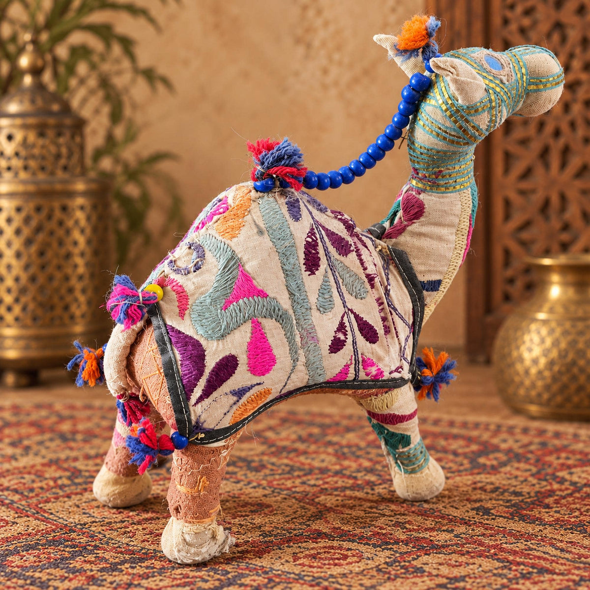 Embroidered Indian fabric camel figurine with blue beads, colorful tassels and bohemian folk art details
