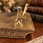 Grand piano music box with amber marbled top, ornate gold-tone detailing and Swiss musical movement