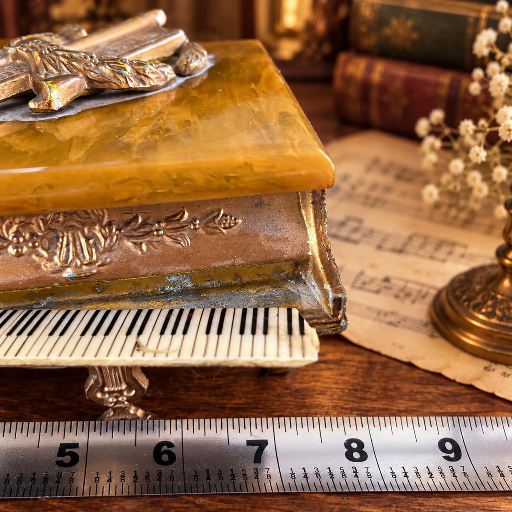 Grand piano music box with amber marbled top, ornate gold-tone detailing and Swiss musical movement