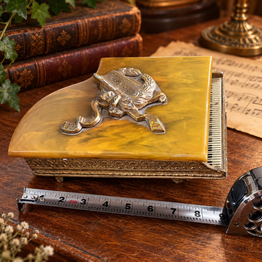 Grand piano music box with amber marbled top, ornate gold-tone detailing and Swiss musical movement