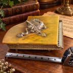 Grand piano music box with amber marbled top, ornate gold-tone detailing and Swiss musical movement