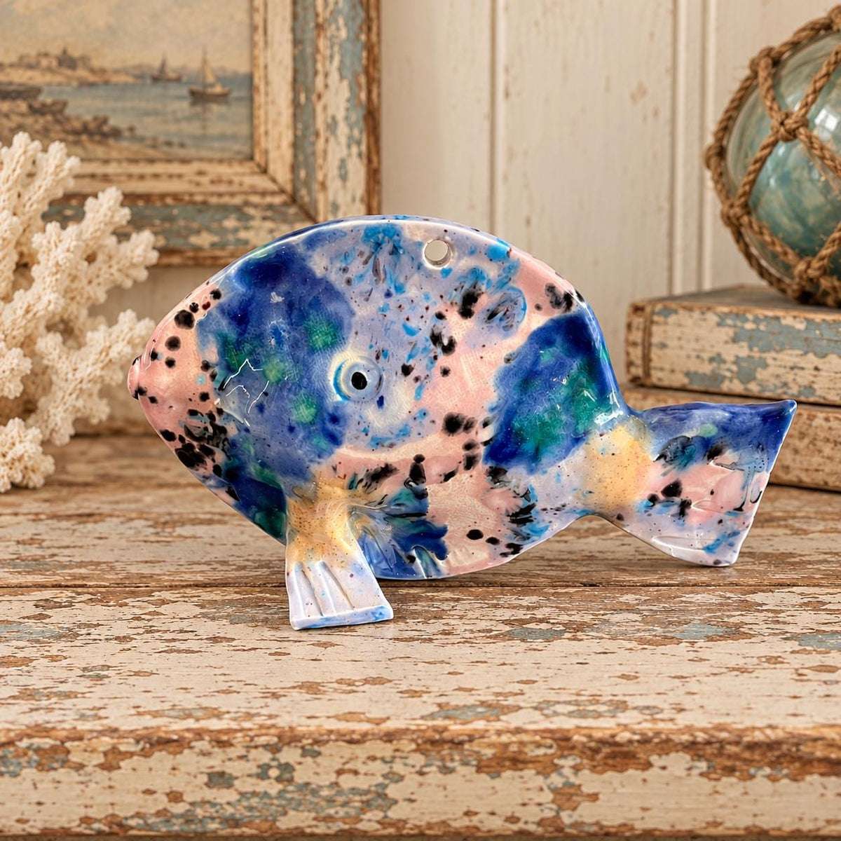 Hand crafted pottery fish sculpture with marbled blue and white glaze