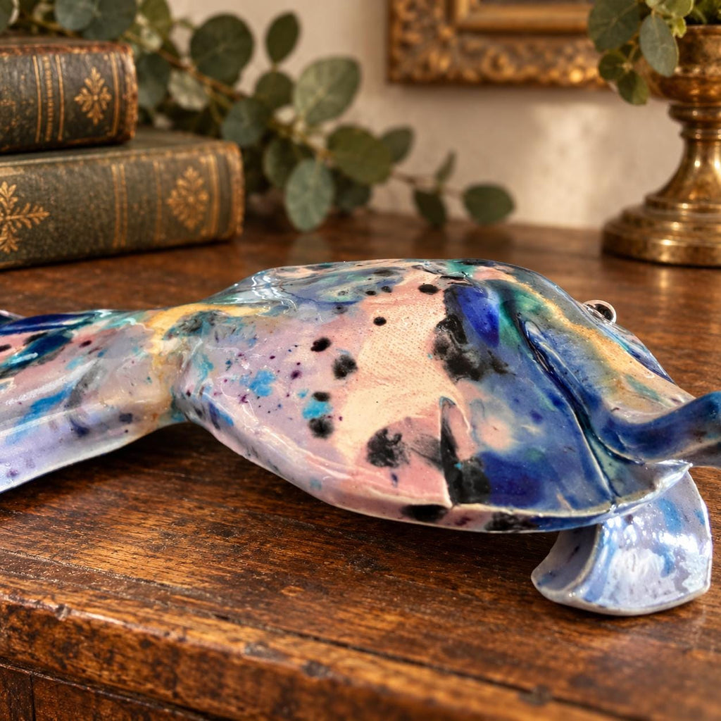 Hand crafted pottery fish sculpture with marbled blue and white glaze