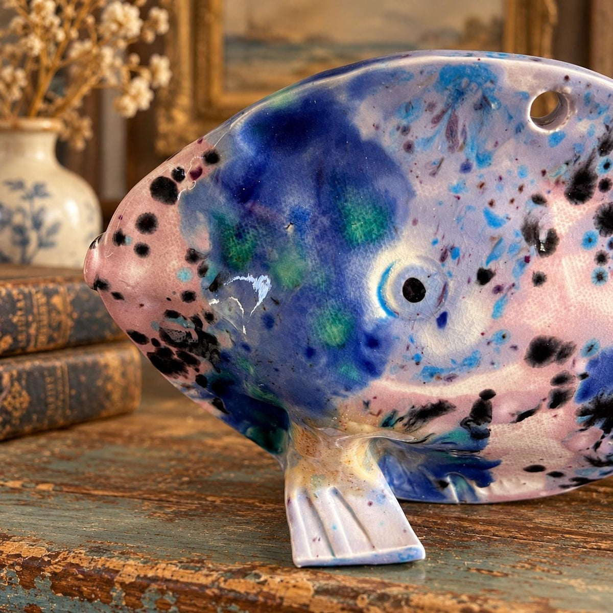 Hand crafted pottery fish sculpture with marbled blue and white glaze