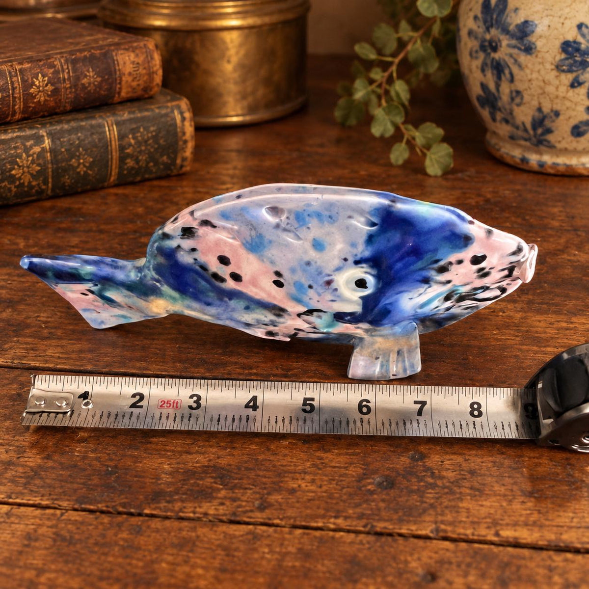Hand crafted pottery fish sculpture with marbled blue and white glaze