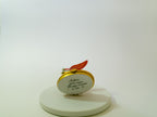 Decorative item on a white pedestal with a plain background