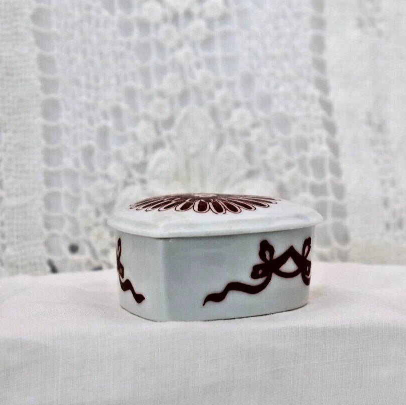 Decorative box with intricate design on a textured surface