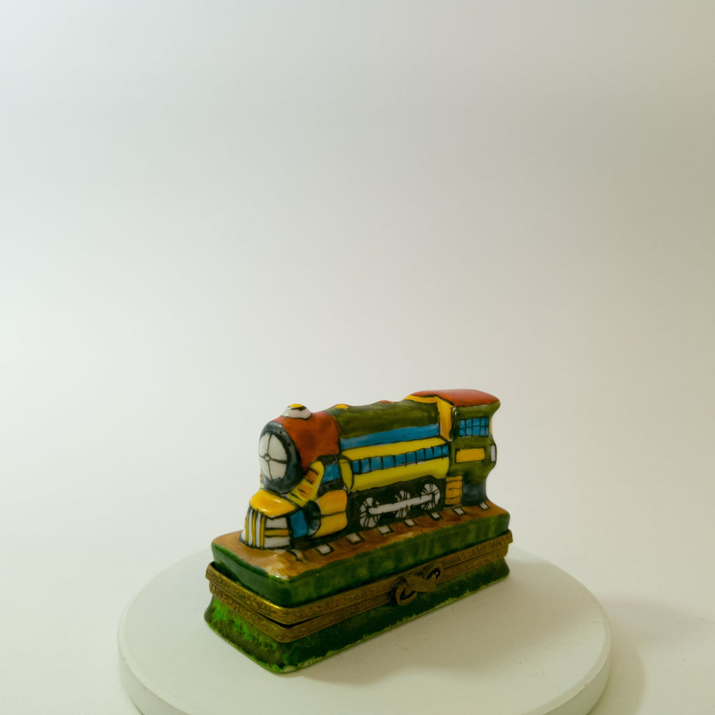 Colorful toy train model on a white background