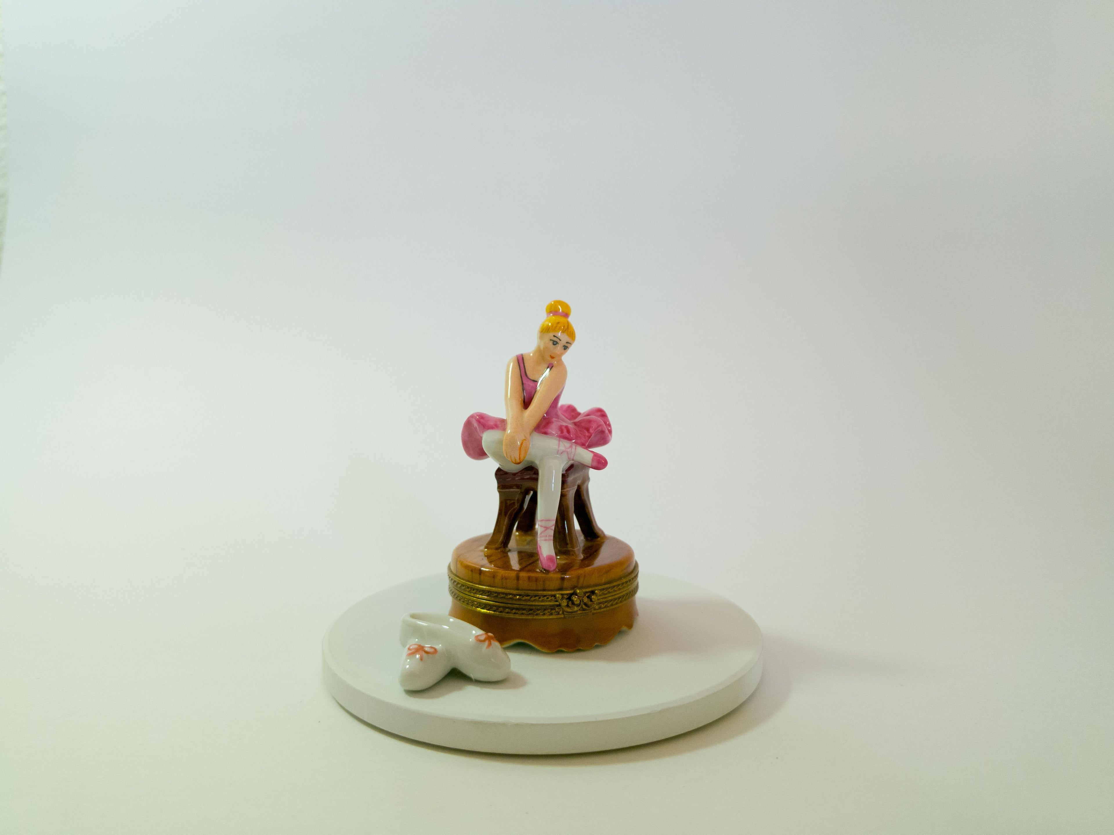 Figurine of a woman on a horse with a dog on a white background