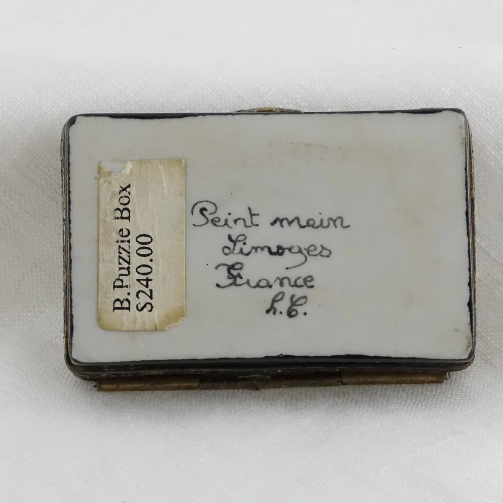 Small puzzle box with a label on a white background