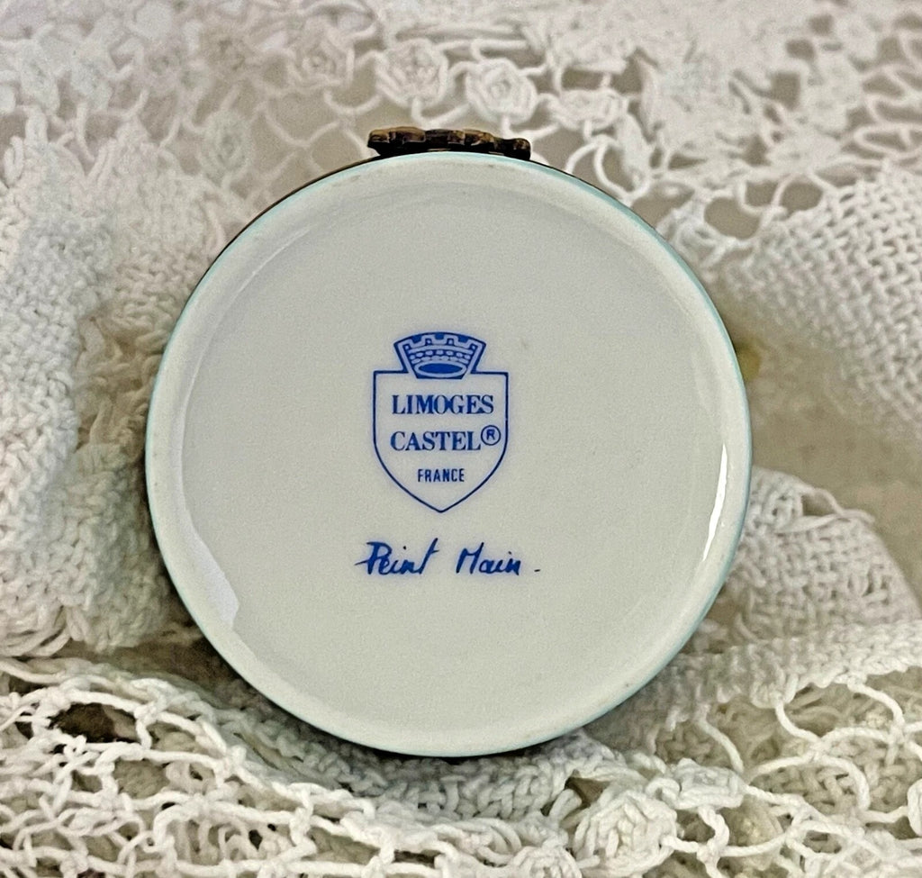 Round Limoges Castel container on a lace background