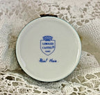 Round Limoges Castel container on a lace background
